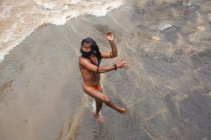 A Sadhu offering prayer in Godavari river during the Simhastha Kumbh Mela, India.