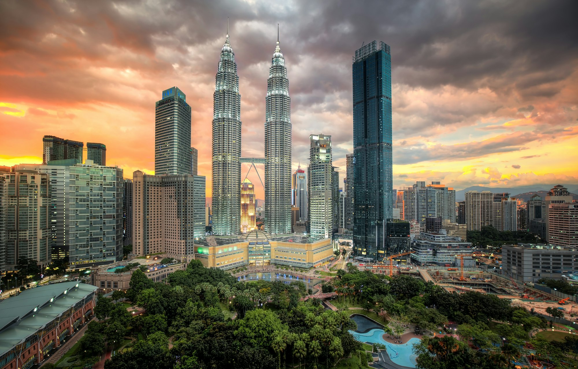 Petronas Twin Towers lit up under a Kuala Lumpur Sunset