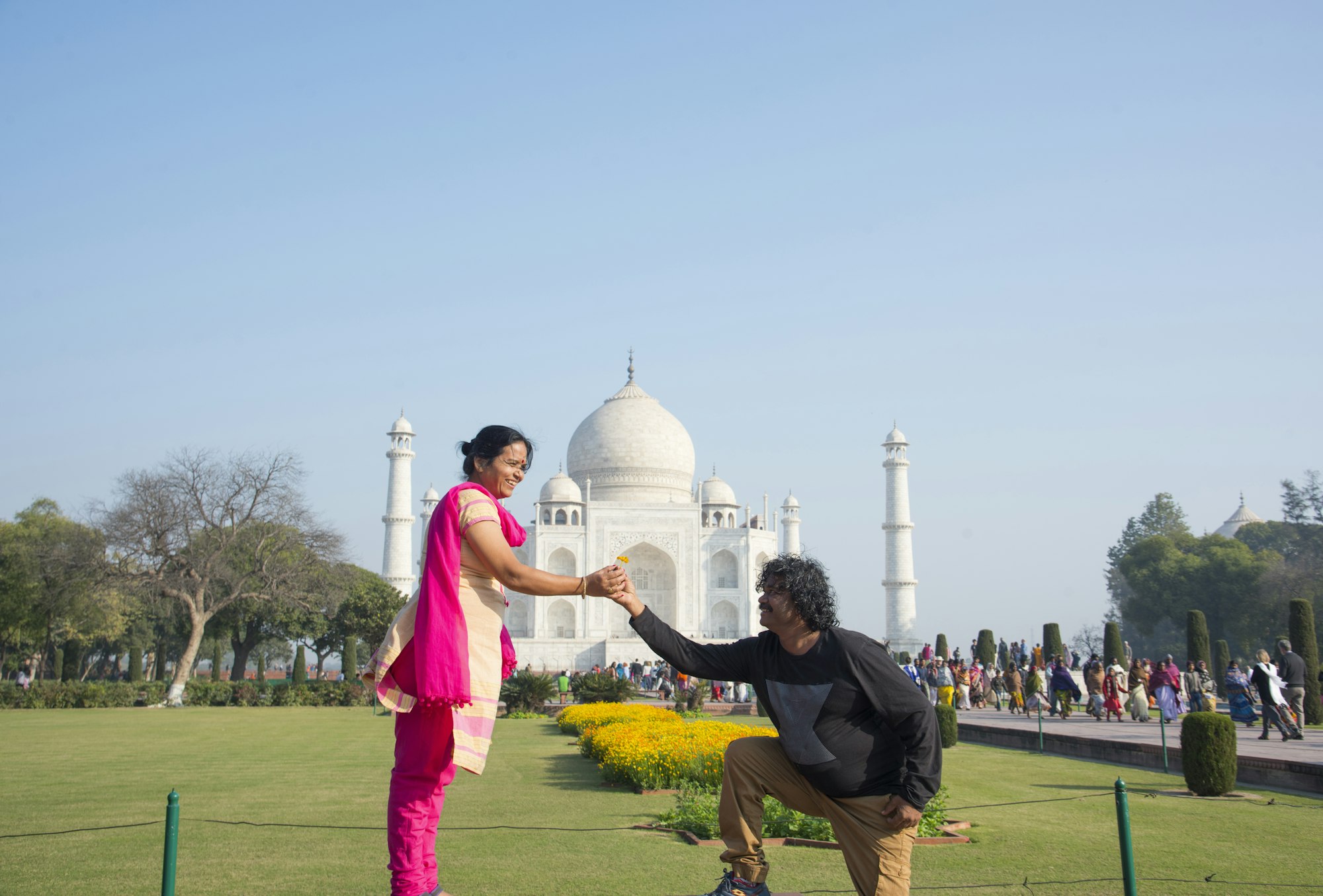 A man proposing woman with the view of Taj Mahal in Agra, India